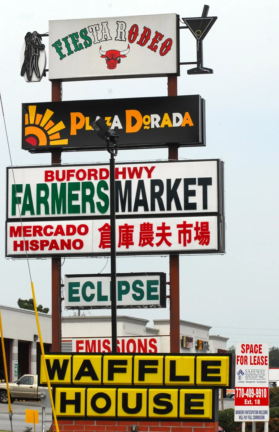 Shop signs in English, Spanish and Chinese on Buford Highway in Doraville, farther up the corridor from Brookhaven