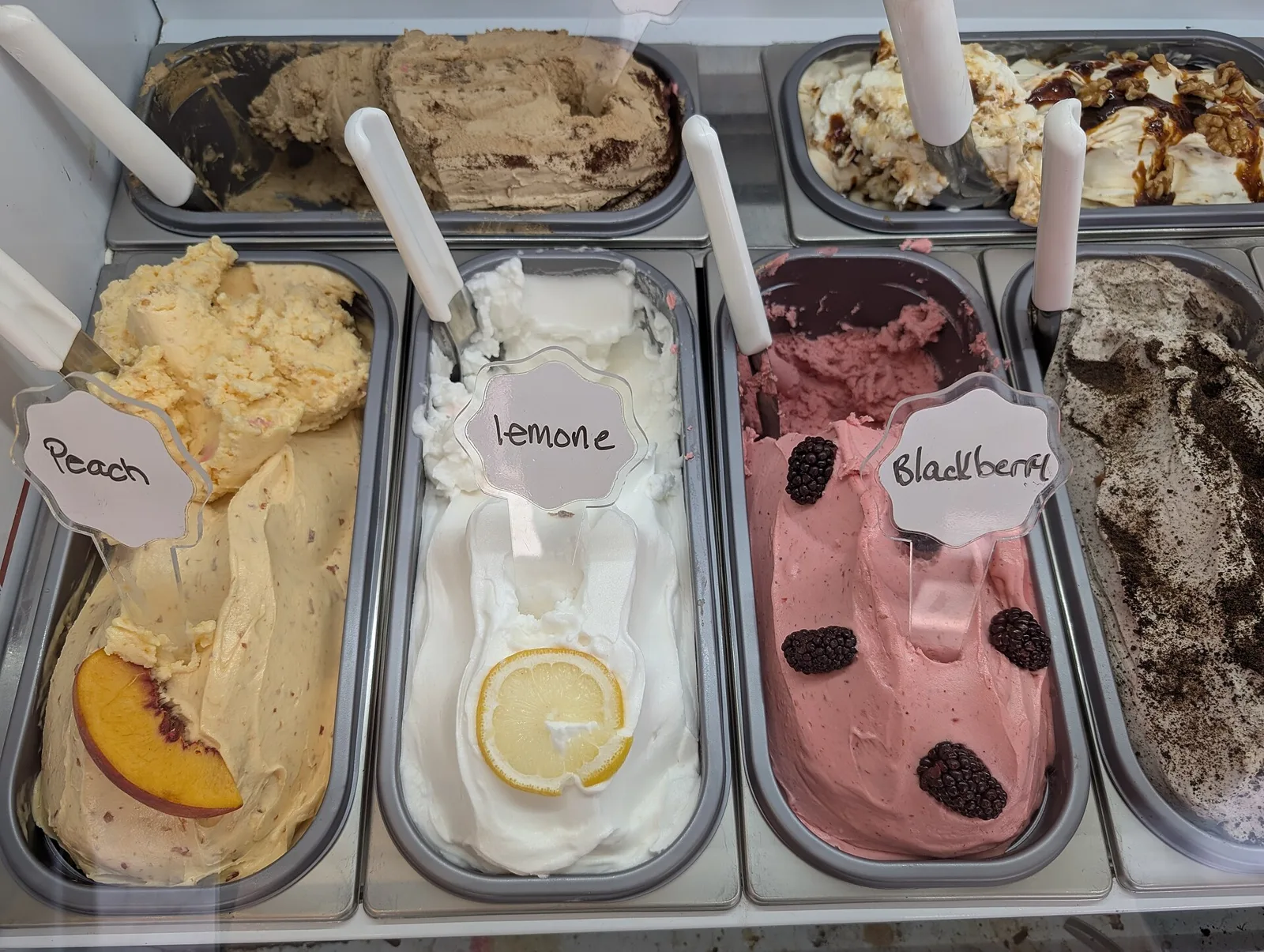Trays of gelato in a shop case. The photo was not taken in Brookhaven.