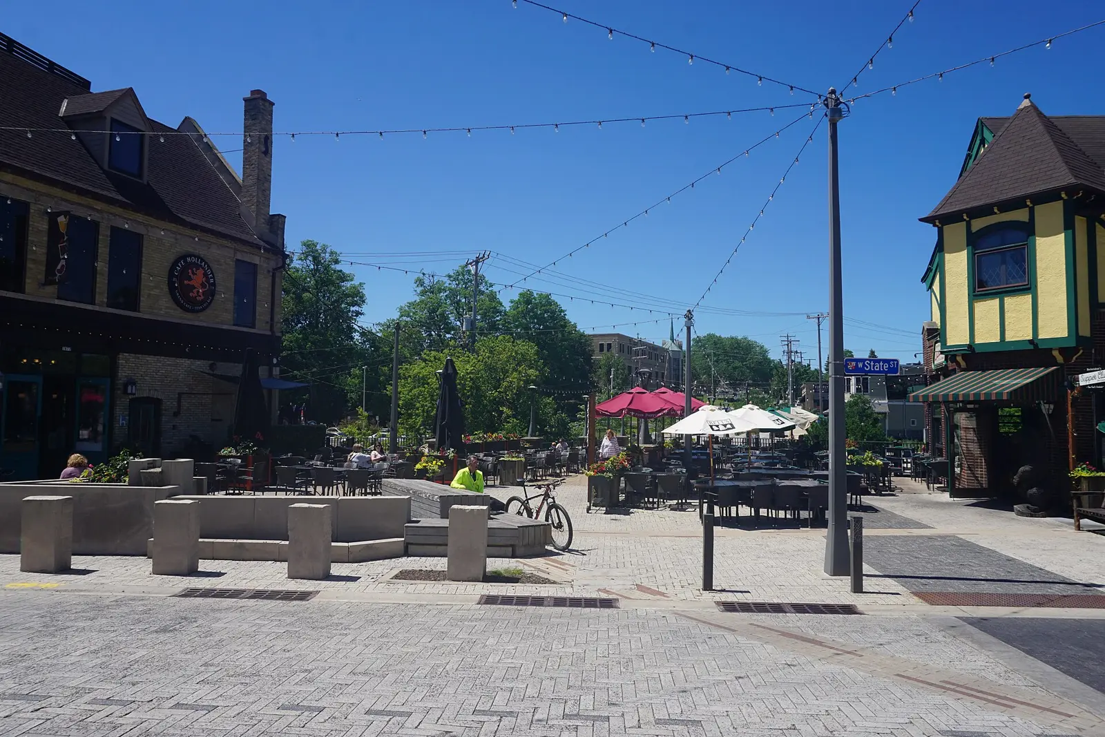 Tables, umbrellas and string lights on a restaurant patio in Wauwatosa, Wisconsin.